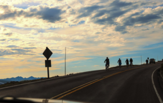 Cyclers biking in Rocky Mountain National Park, heading downhill