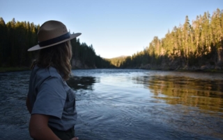 A tour guide looking out onto a Lake in Rocky Mountain National Park