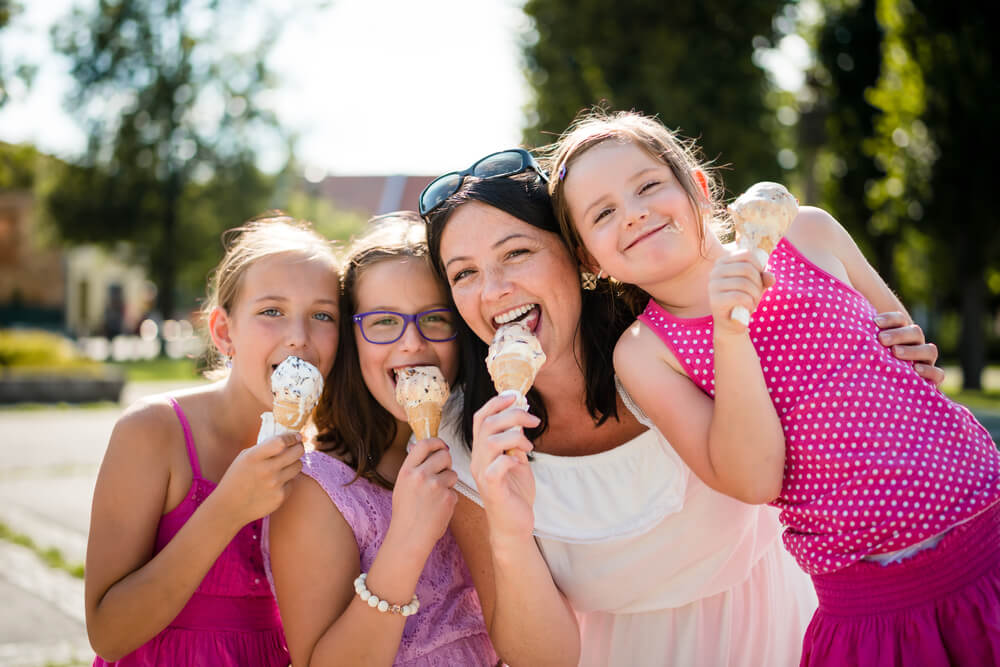 A mother and her three girls eating ice cream in Estes Park